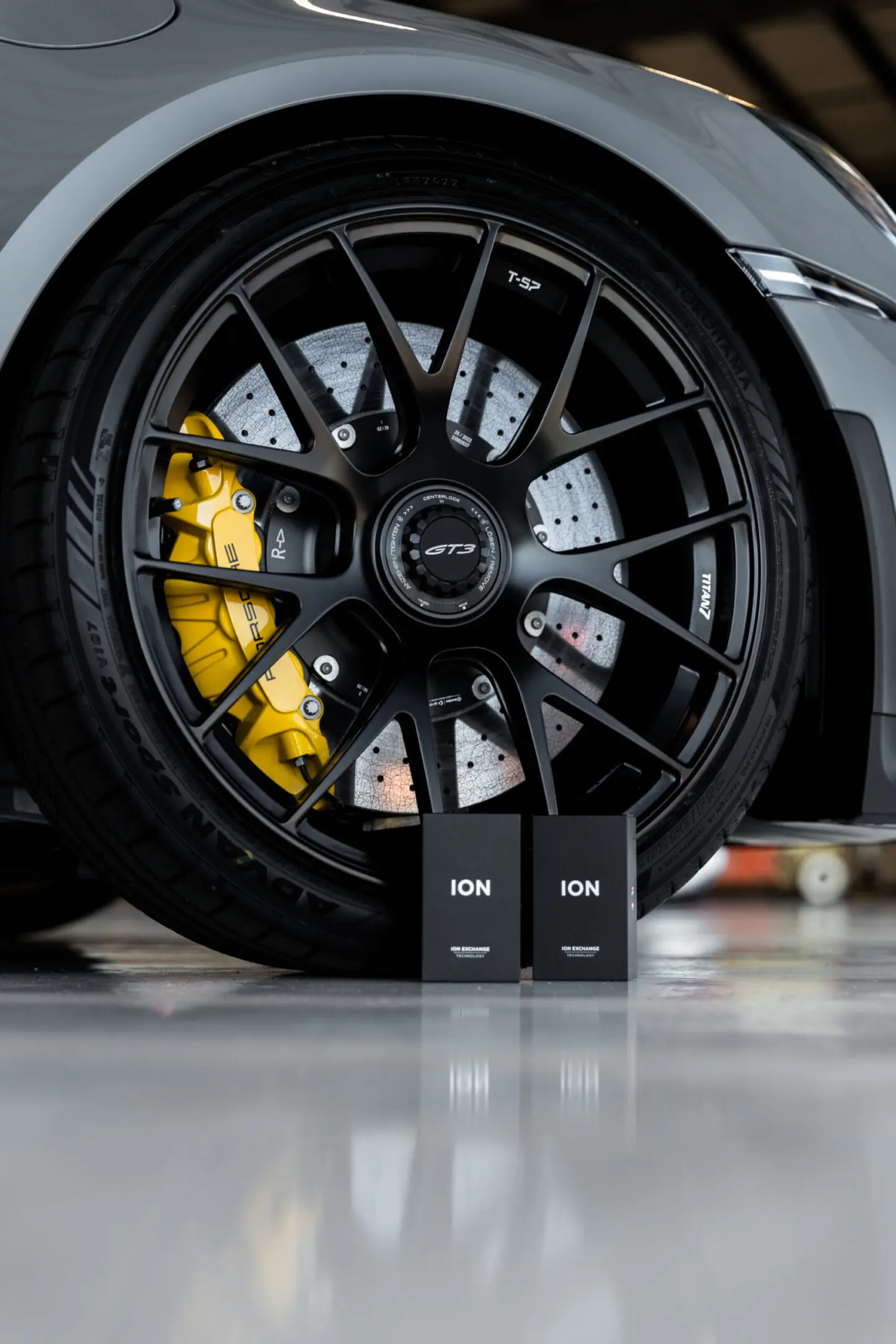 Car wheel with two ION product boxes.