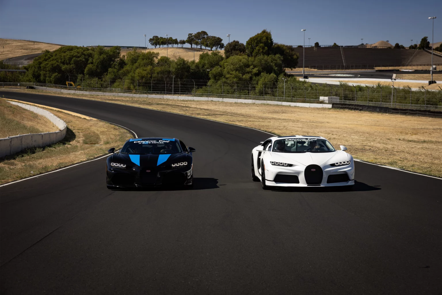 Two sports cars on a racetrack.