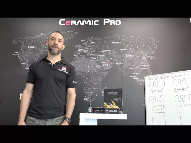 Man standing in front of world map.